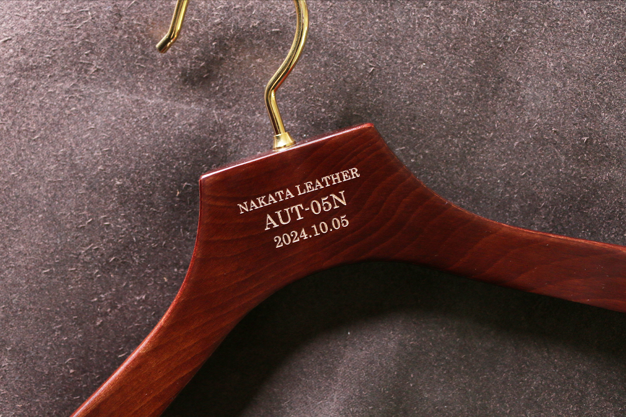 Wooden hanger engraved original brand name date