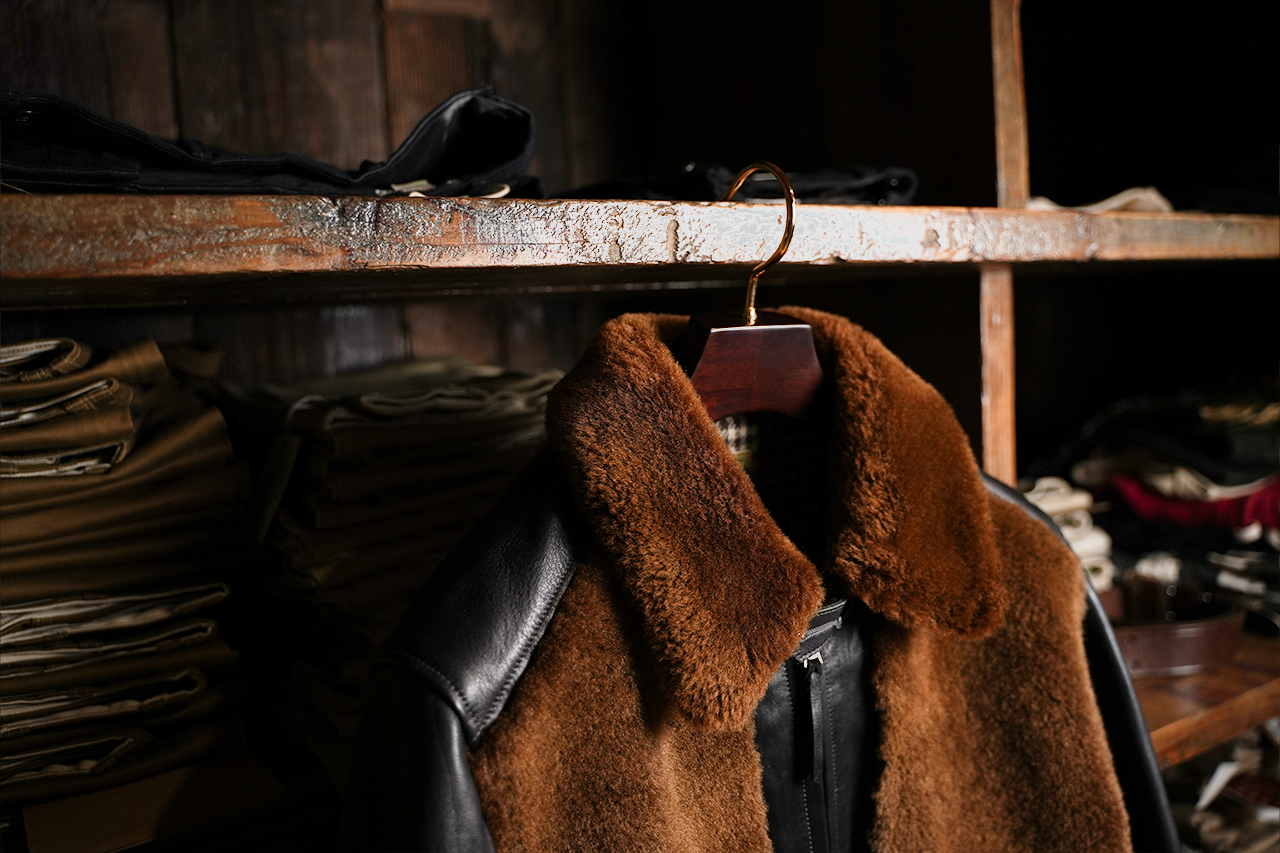 Leather jacket hanging on a wooden hanger